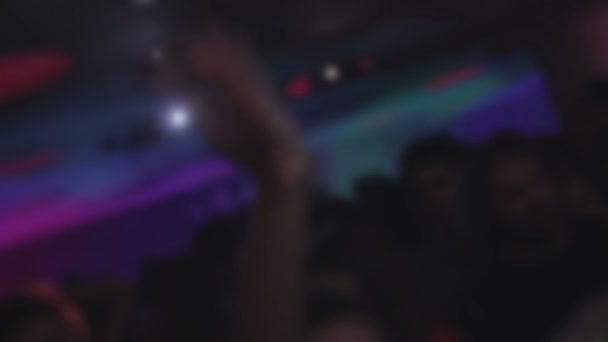 People clubbing, hands up in air, enjoying music, having fun — Stock Video