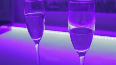 Close-up of two glasses of sparkling champagne, romantic date