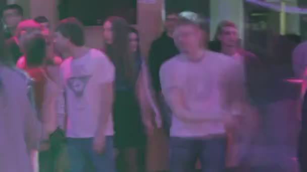 Timelapse of many young people hanging out at night club, motion — Stock Video