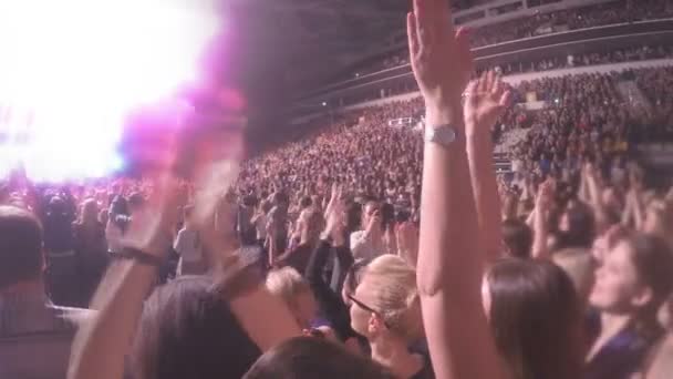 Young men and women applauding to popular singer, enjoying concert atmosphere — Stock Video