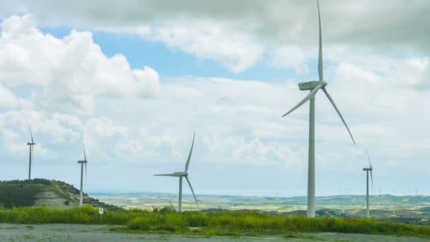 Windmill propellers spinning. Green energy generation. Clouds in stormy sky — Stock Video