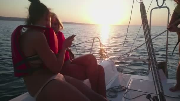 Beautiful girls having fun, enjoying trip on yacht, talking, summer cruise — Stock Video