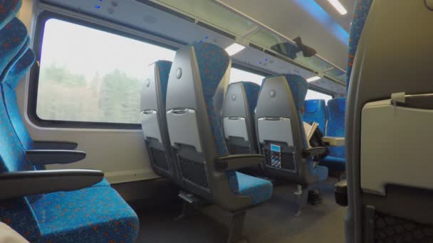 Many empty seats on comfortable intercity express train moving at high speed — Stock Video