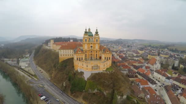 Aerial view of Melk Abbey in Austria, foggy spring day in old European city — Stock Video