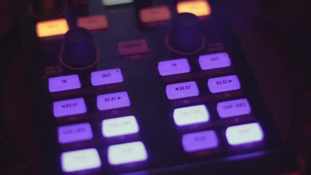 Professional DJ deck, male hands tweak controls, buttons closeup — Stock Video