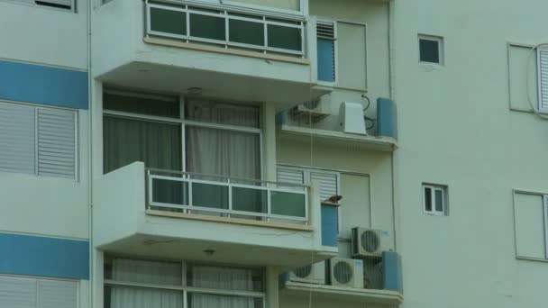 Establishing shot of apartment building facade. Mortgage loan on real property — Stock Video