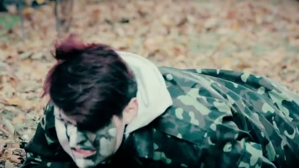 Scary man in military uniform crawling in forest, zombie invasion, horror movie — Stock Video