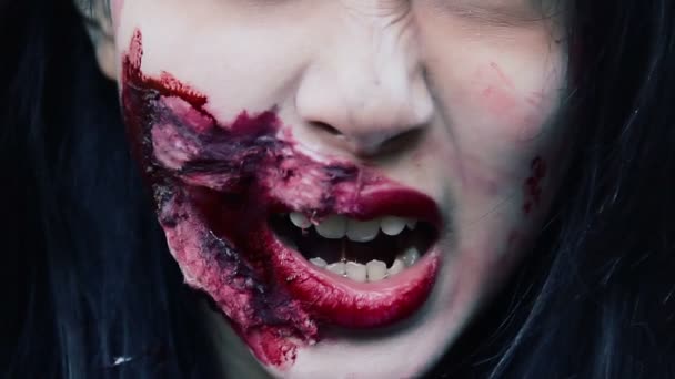 Closeup of terrible vampire face with bloody wound near mouth, dangerous monster — Stock Video