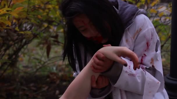 Hungry female vampire eating victim's dead body, monsters invasion, cannibalism — Stock Video