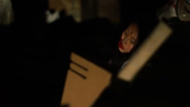 Dead woman lying in dark street, crime scene, unconscious victim of accident — Stock Video