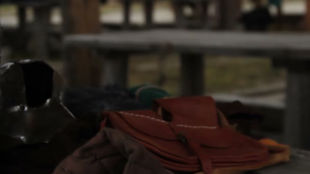 Close up shot of steel plate helmet and leather equipment of medieval warrior — Stock Video