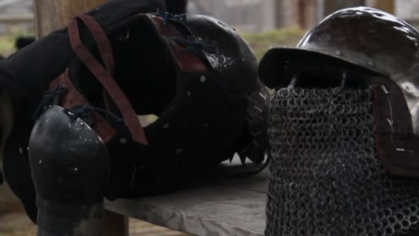 Steel armour and helmet with chain mail facemask prepared by warrior for Crusade — Stock Video