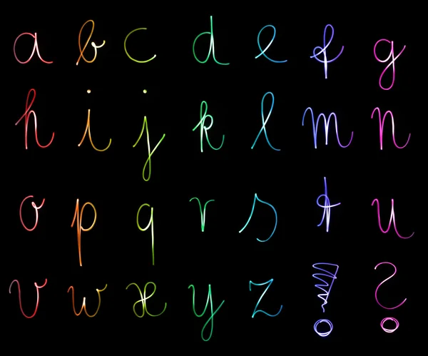 Flourescent letters of the alphabet in different neon colors — Stock Photo, Image