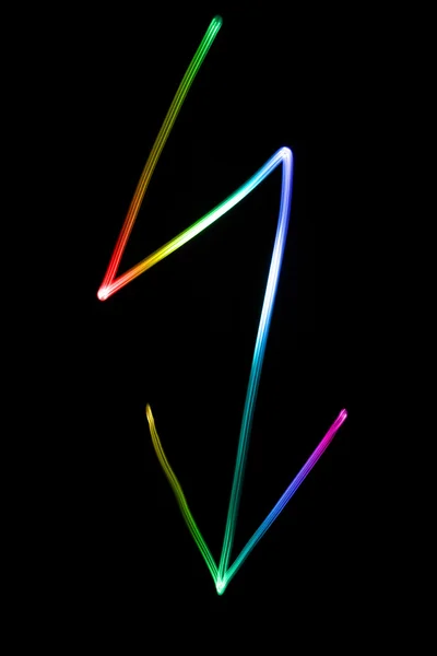 Flourescent Symbol eines Blitzes in verschiedenen Neonfarben — Stockfoto