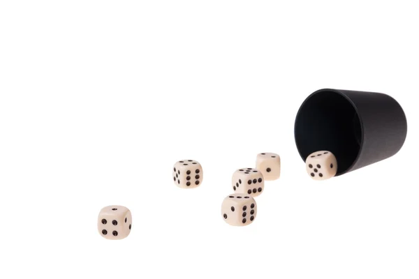 Dice cup with several dices on a white background — Stock Photo, Image