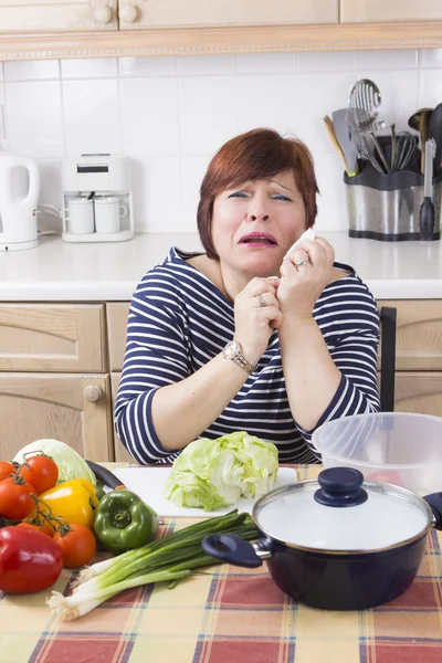 Portrait of unhappy woman in kitchen — Stock Photo, Image