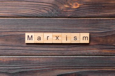 marxism word written on wood block. marxism text on table, concept. clipart
