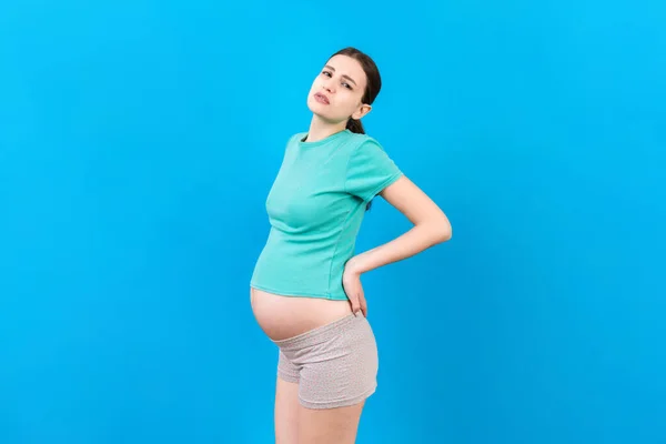 Mujer Embarazada Con Dolor Espalda Sobre Fondo Color Aislado —  Fotos de Stock