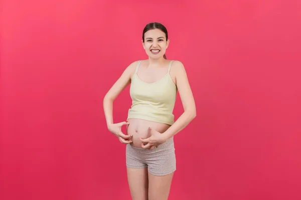 Zwangere Vrouw Krassen Haar Buik Gekleurde Achtergrond — Stockfoto