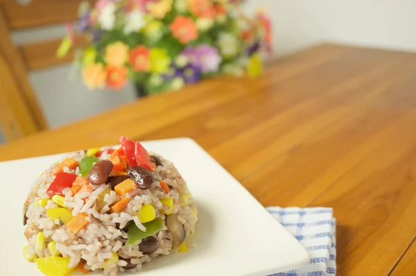 Fried rice vegetarian with blue fabric on wood table — Zdjęcie stockowe
