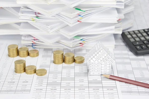Brown pencil and house with step pile of gold coins — Stock Photo, Image