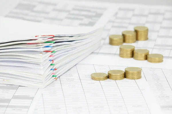 Step pile of gold coins and overload of paperwork — Stock Photo, Image