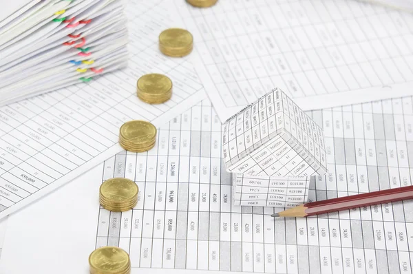 House with brown pencil and pile line of gold coins — Stock Photo, Image