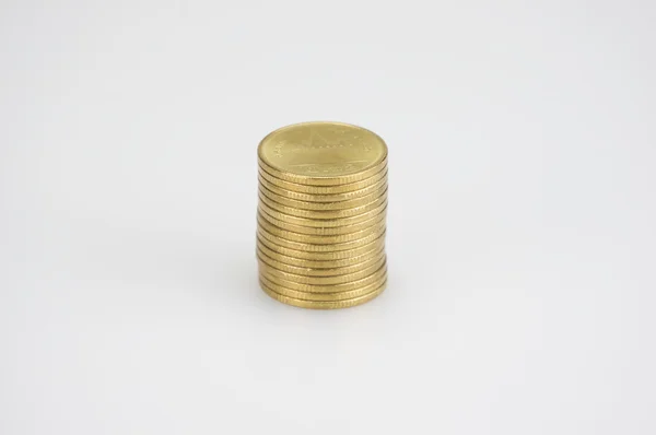 Close up pile of gold coins isolated on white background — Stock Photo, Image