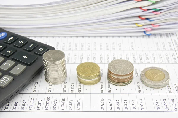 Pile coins and calculator place on finance account — Stock Photo, Image