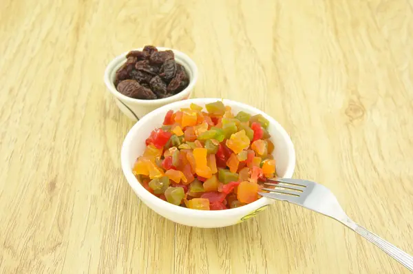 Close up dried fruit and raisin with fork — Stock Photo, Image