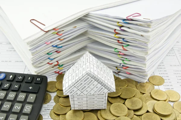 House on pile of gold coin with calculator — Stock Photo, Image