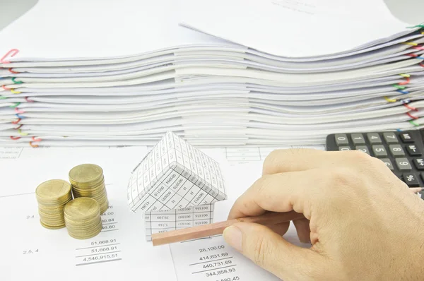 Man holding pencil horizon over balance sheet — Stock Photo, Image