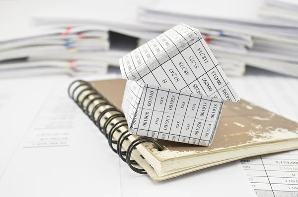 Close up house and closed old notebook on finance account — Stock Photo, Image