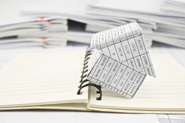 Close up house and open notebook — Stock Photo, Image