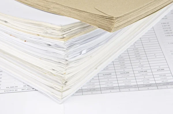 Brown envelope and overload of old paperwork — Stock Photo, Image