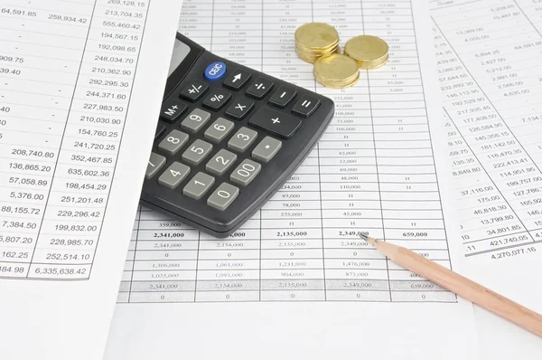 Pencil with calculator and gold coin — Stock Photo, Image