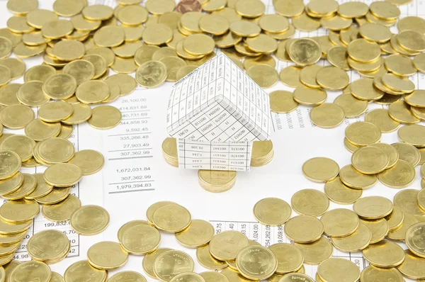 House on pile of gold coins have gold coins around — Stock Photo, Image