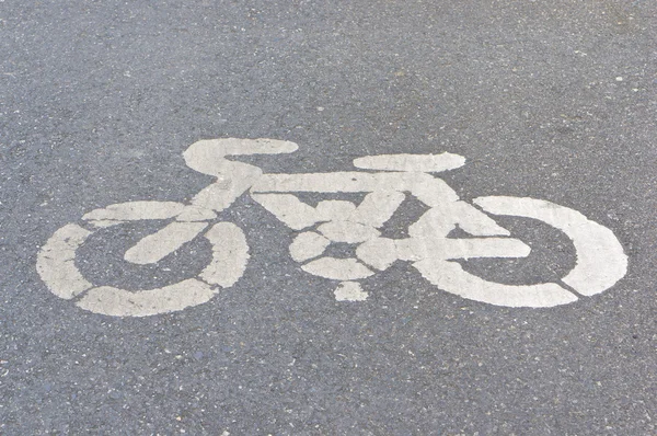 Old white painted sign of bicycle lane — Stock Photo, Image