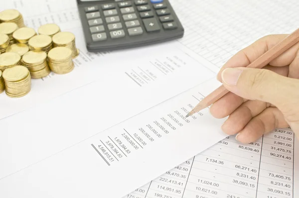 Man holding pencil to audit  finance account — Stock fotografie