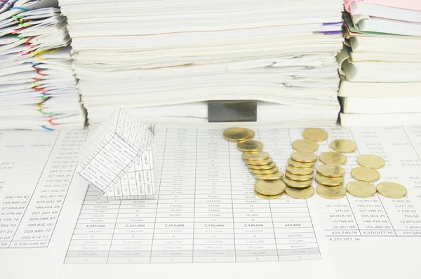 Bankruptcy house with gold coins fall have paper as background — Stock Photo, Image