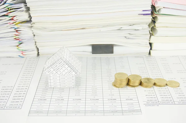 House and step of gold coins have paperwork as background — Stock Photo, Image