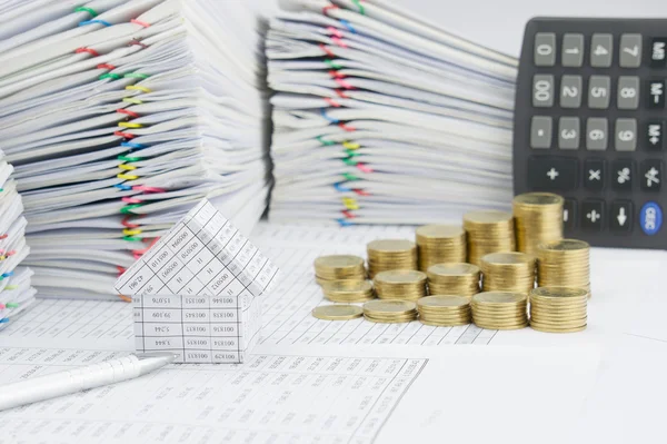 House and silver pen have blur step gold coins — Stock Photo, Image