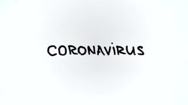  Tıbbi eldivendeki bir el CORONAVIRYS kelimesini siliyor. . 