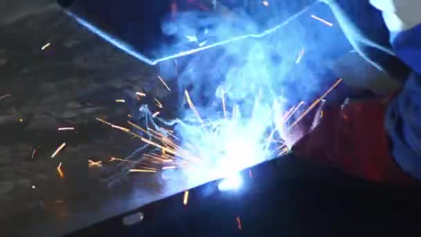 A strong welder worker are welding in the construction site in the factory. — Stock Video