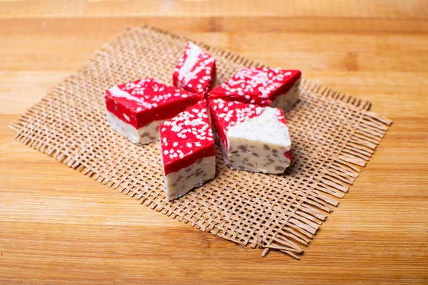 Hazelnut halva dessert with pomegranate juice on the wooden table. — Stock Photo, Image