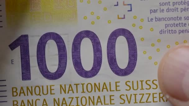 Hands Holding 1000 Swiss Franc Banknote — Stock Video