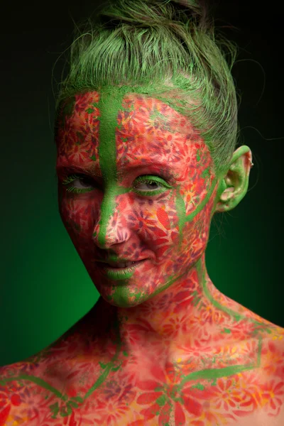 Emotional woman with red multi lines and green hair — Stock Photo, Image