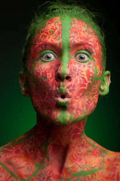 Emotional woman with red multi lines and green hair — Stock Photo, Image