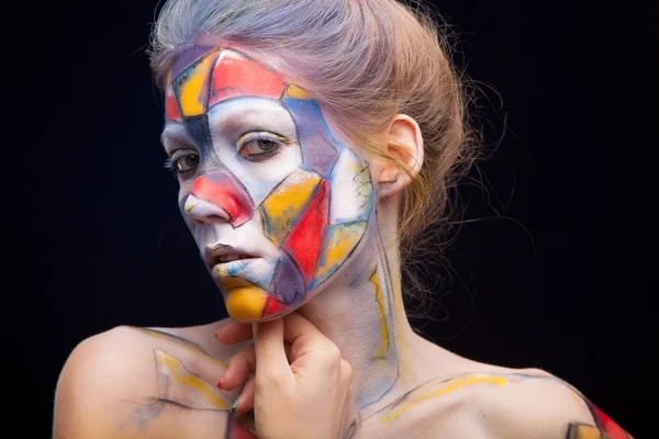 Kobieta ze sztuką twarzy — Zdjęcie stockowe