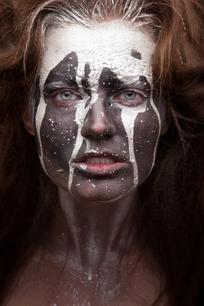 Woman portrait with face art